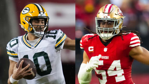 Packers quarterback Jordan Love pushes off a defender. 49ers linebacker Fred Warner runs during a play.